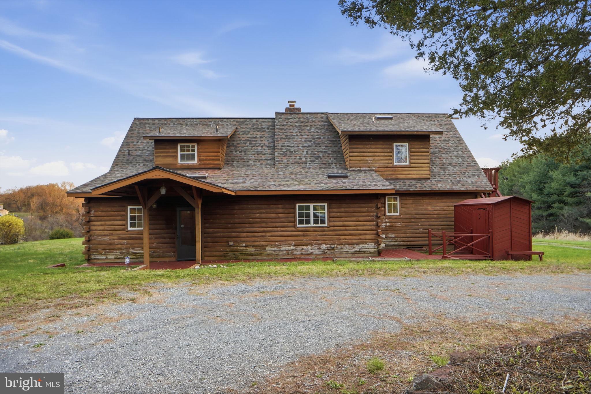 21142 Westerly Road Poolesville, MD 20837 - Photo 36 of 76 a front view of a house with a garden