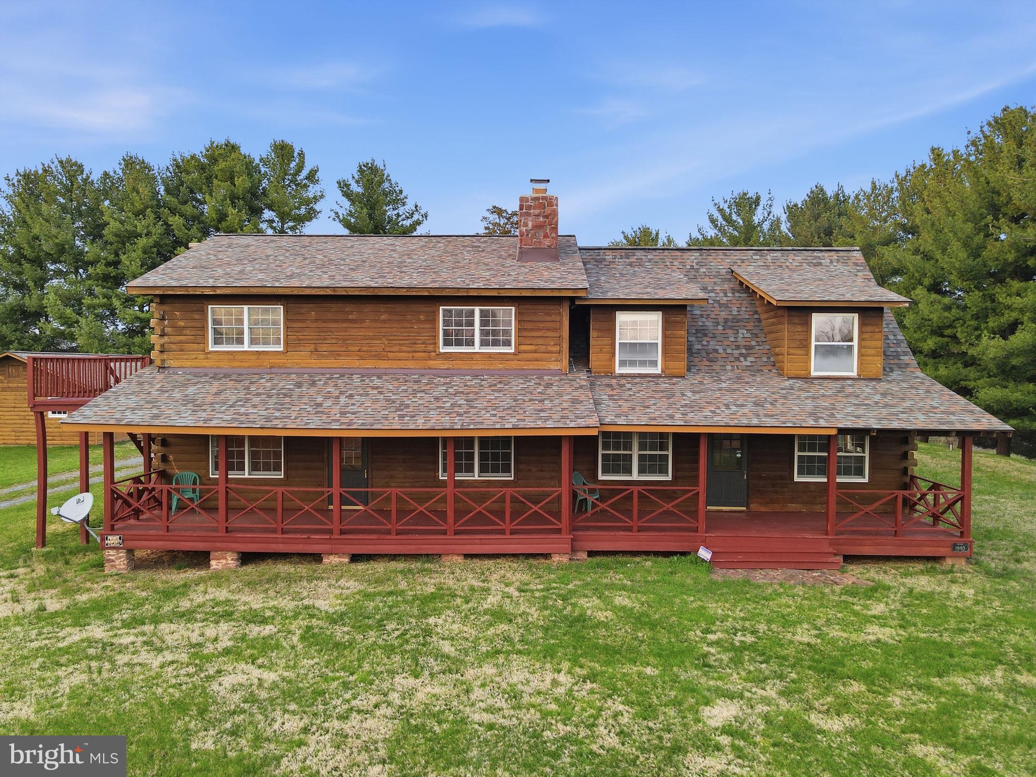 21142 Westerly Road Poolesville, MD 20837 - Photo 5 of 76 a front view of a house with garden