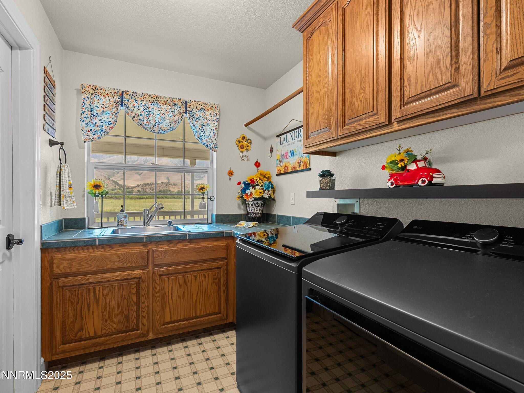 801 Larson Lane Coleville, CA 96107 - Photo 25 of 37 a kitchen with stainless steel appliances a sink dishwasher stove and cabinets