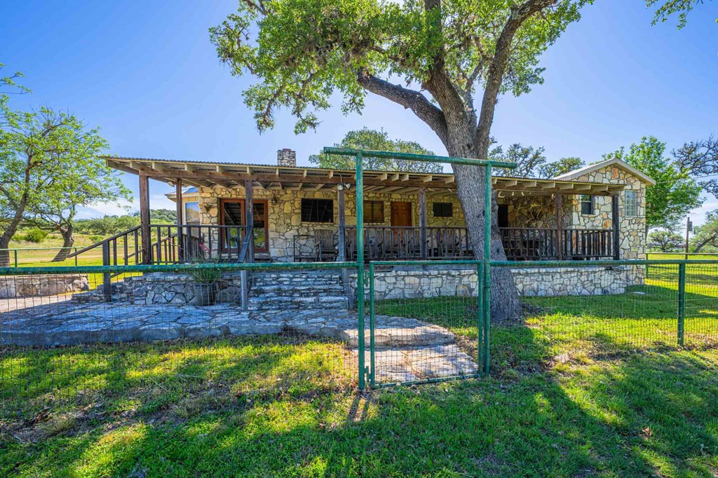 161 East Flach Road Comfort, TX 78013 - Photo 28 of 91 a view of a house with a yard