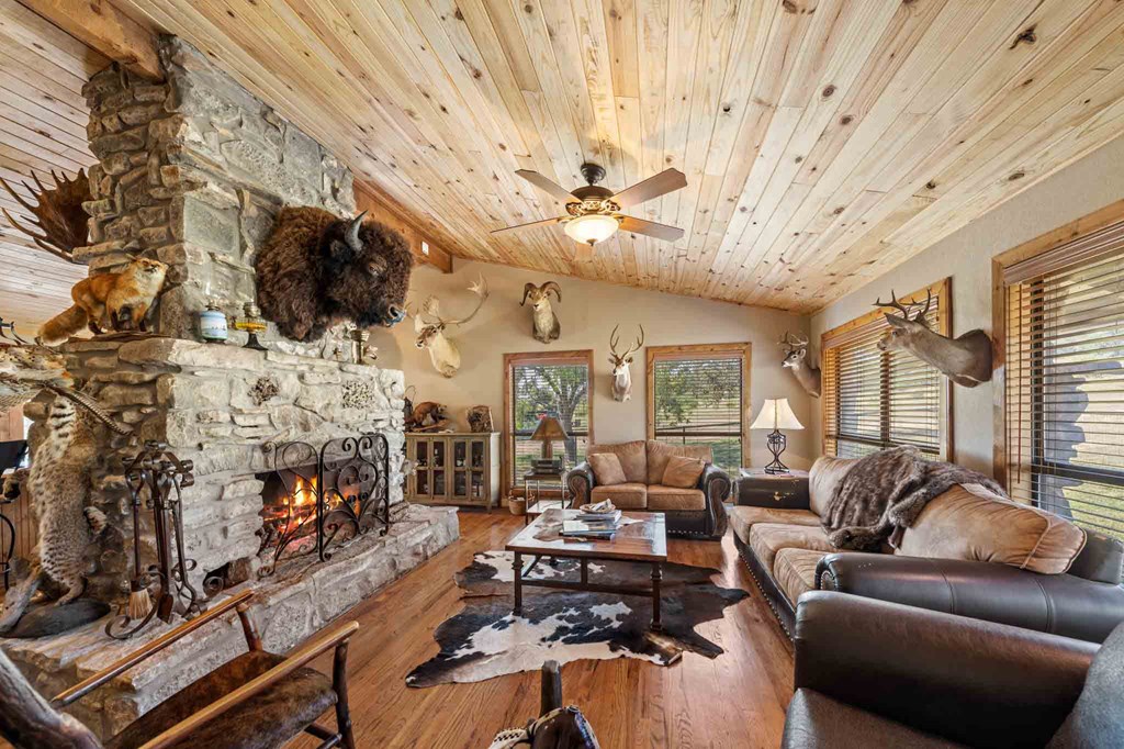 161 East Flach Road Comfort, TX 78013 - Photo 30 of 91 a living room with fireplace furniture flat screen tv and a fireplace