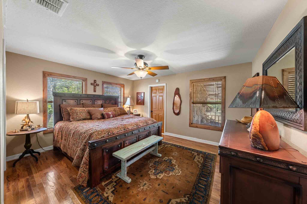 161 East Flach Road Comfort, TX 78013 - Photo 37 of 91 a spacious bedroom with a bed and window
