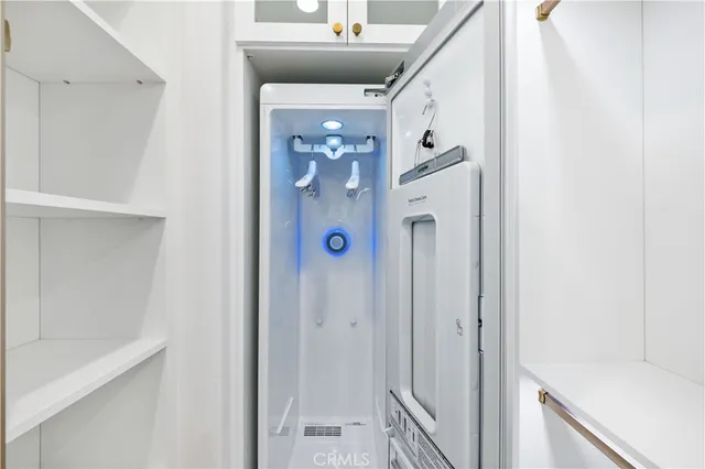 a bathroom with a shower and a door
