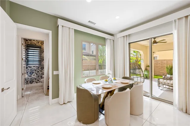 a room with granite countertop a couch and a table