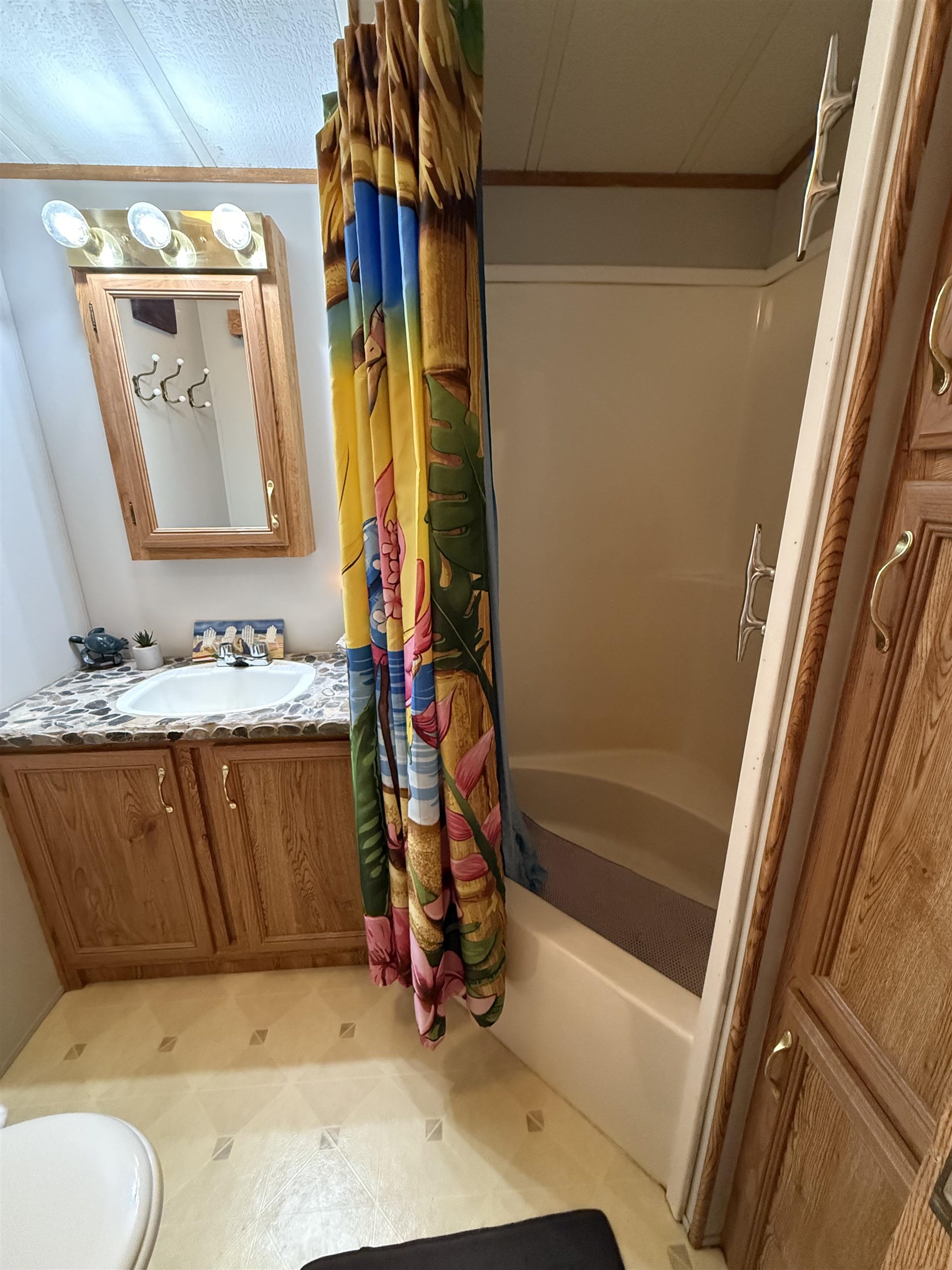 3066 Highway 9 Ocean View, NJ 08230 - Photo 11 of 22 a bathroom with a tub sink and mirror