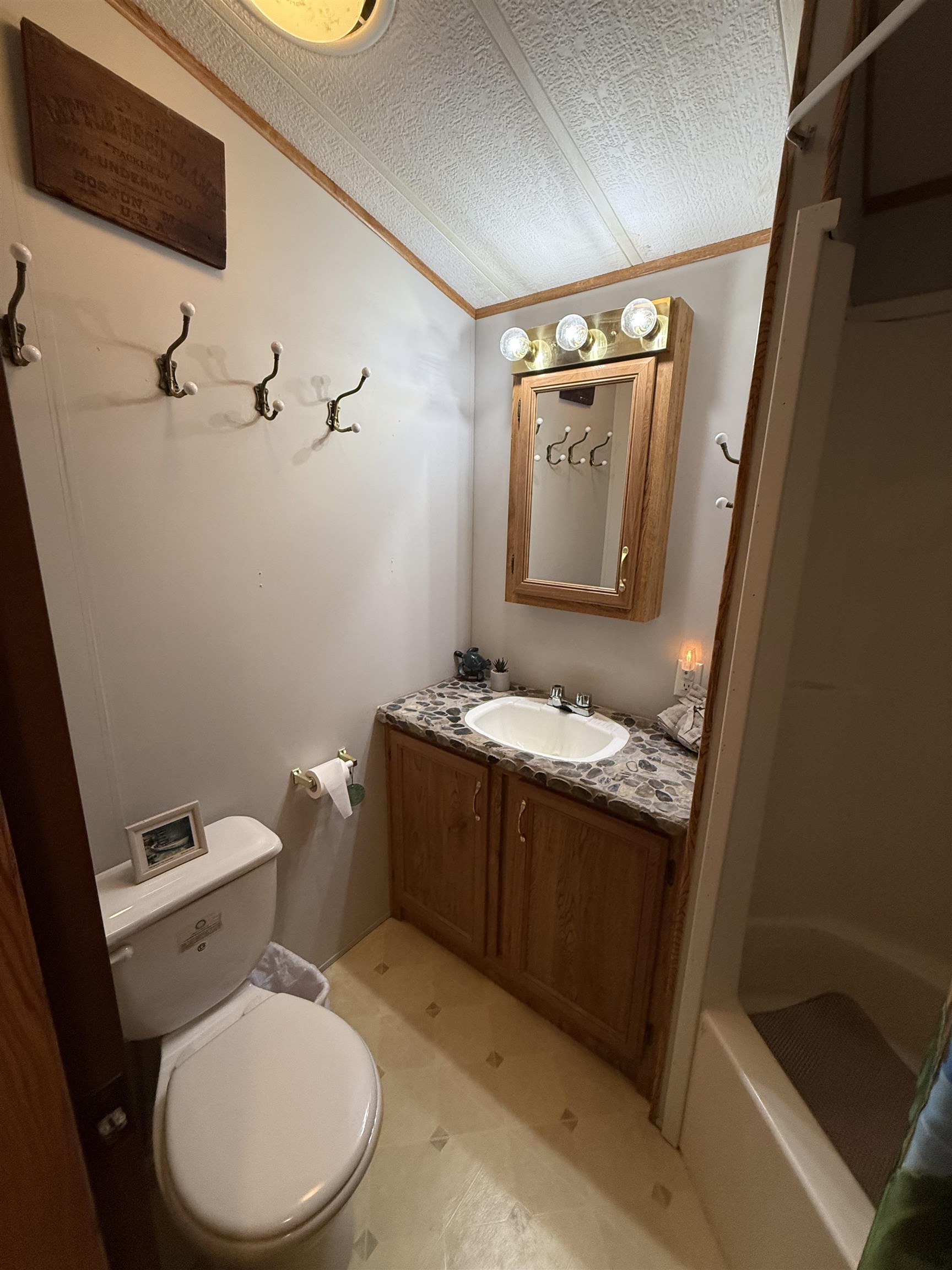 3066 Highway 9 Ocean View, NJ 08230 - Photo 12 of 22 a bathroom with a granite countertop toilet sink and mirror