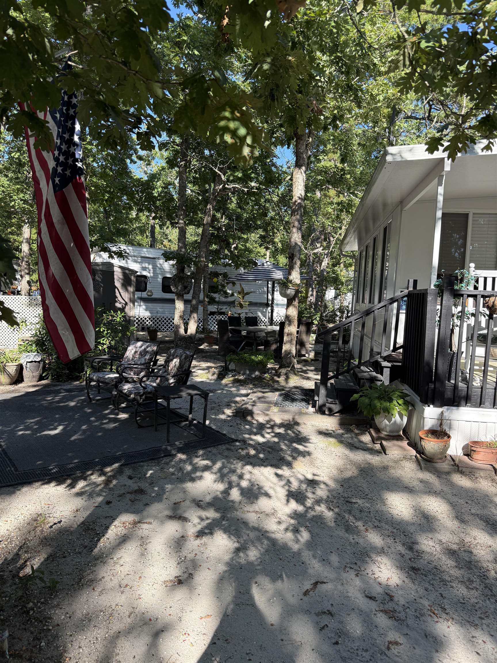 3066 Highway 9 Ocean View, NJ 08230 - Photo 20 of 22 a backyard of a house with barbeque oven and outdoor seating