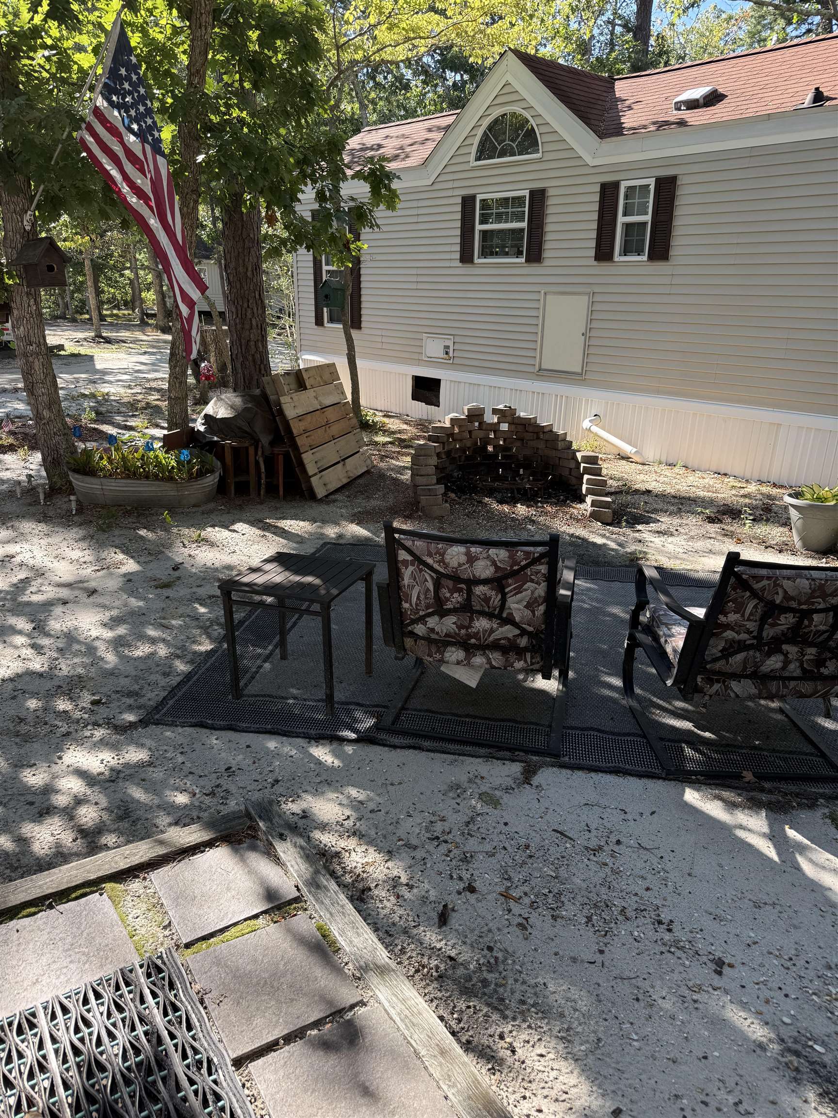 3066 Highway 9 Ocean View, NJ 08230 - Photo 2 of 22 a backyard of a house with barbeque oven and outdoor seating