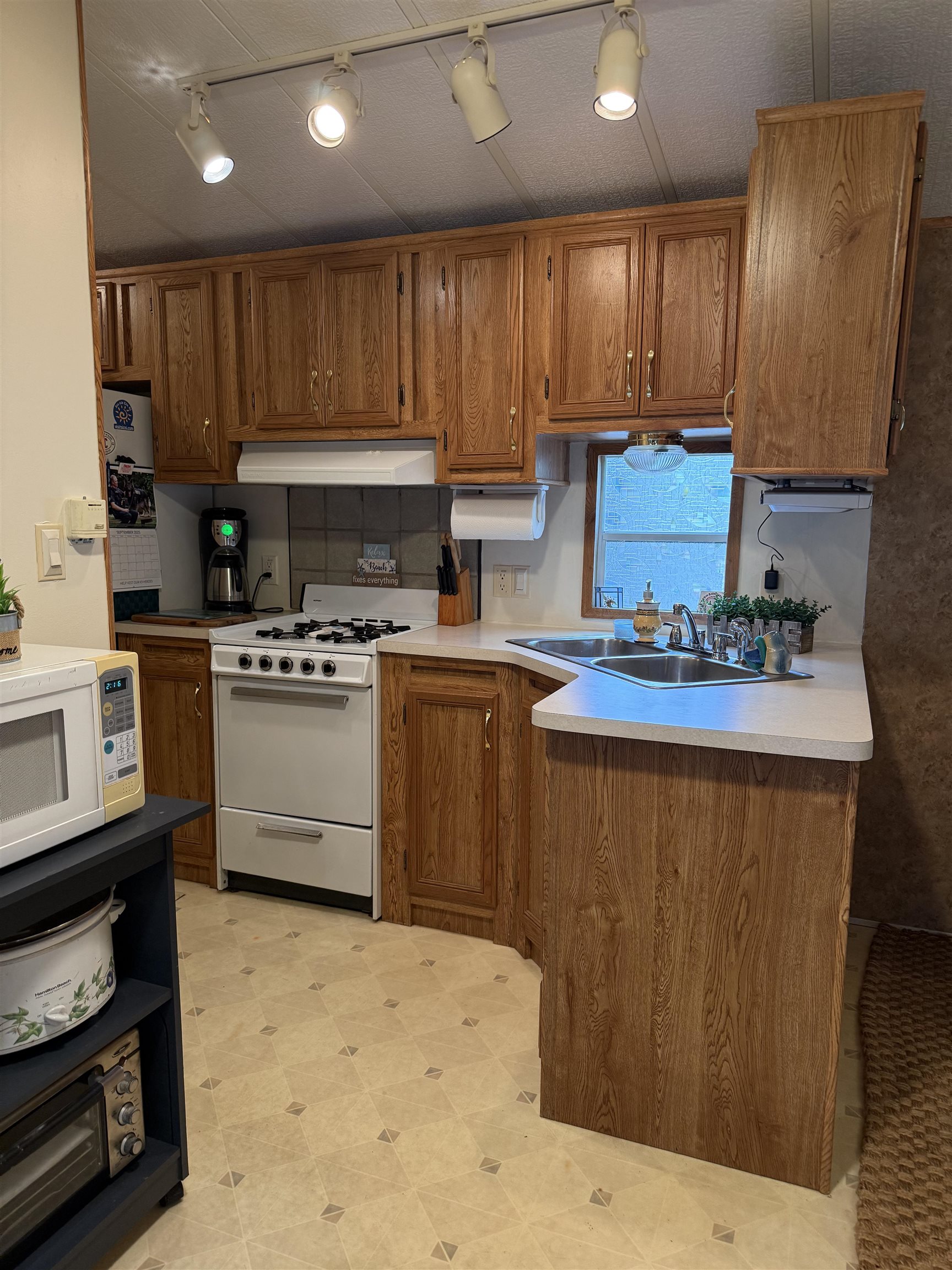 3066 Highway 9 Ocean View, NJ 08230 - Photo 21 of 22 a kitchen with stainless steel appliances kitchen island granite countertop a stove sink and cabinets