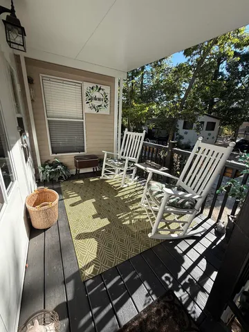 a view of swimming pool with seating area