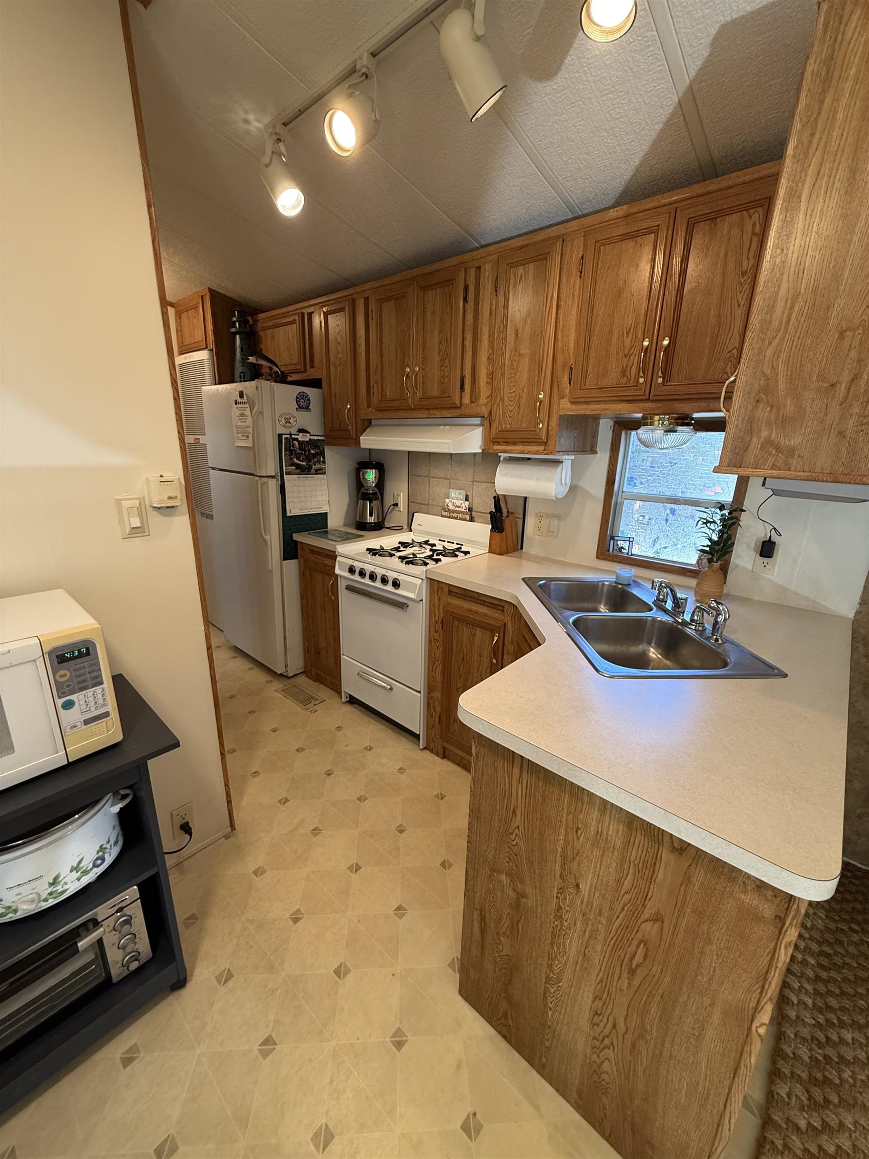 3066 Highway 9 Ocean View, NJ 08230 - Photo 10 of 22 a kitchen with refrigerator and cabinets