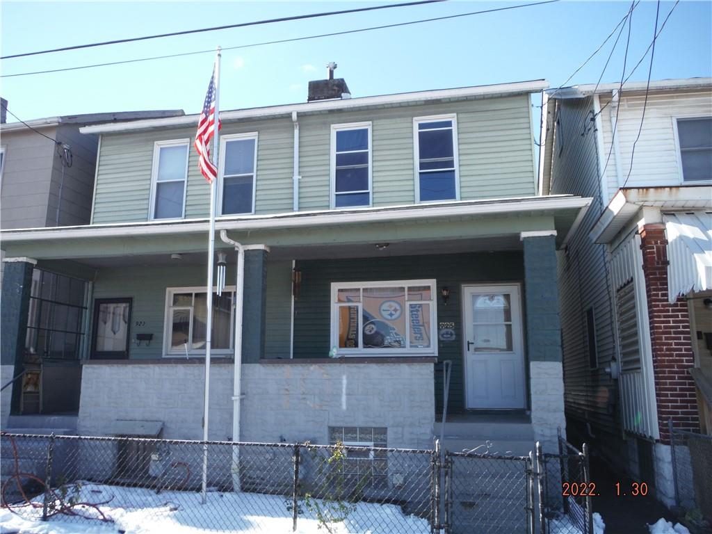 923 Robinson Street McKees Rocks, PA 15136 - Photo 1 of 1 a front view of a house with a garage