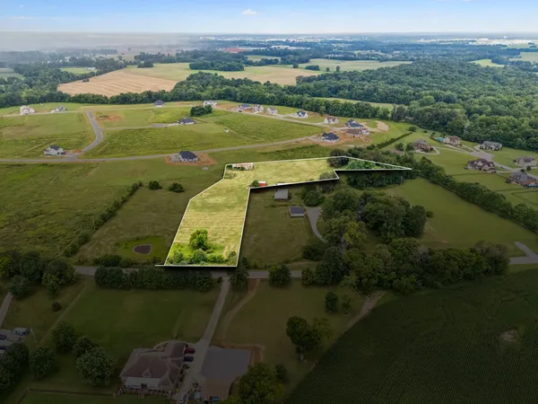 aerial view of a house with a lake view