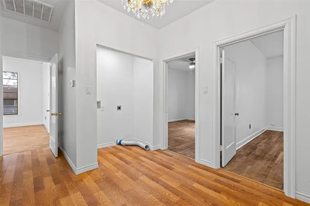 a kitchen with stainless steel appliances granite countertop white cabinets and a stove a oven with white countertops