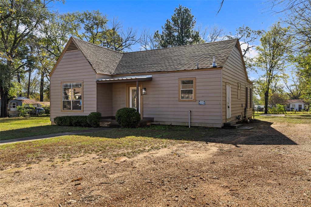 204 Jones Street Longview, TX 75602 - Photo 18 of 38 a view of a house with a yard