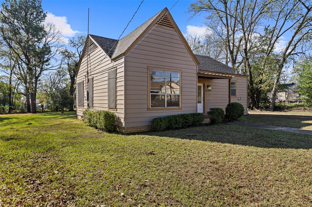 204 Jones Street Longview, TX 75602 - Photo 19 of 38 a view of a house with a yard