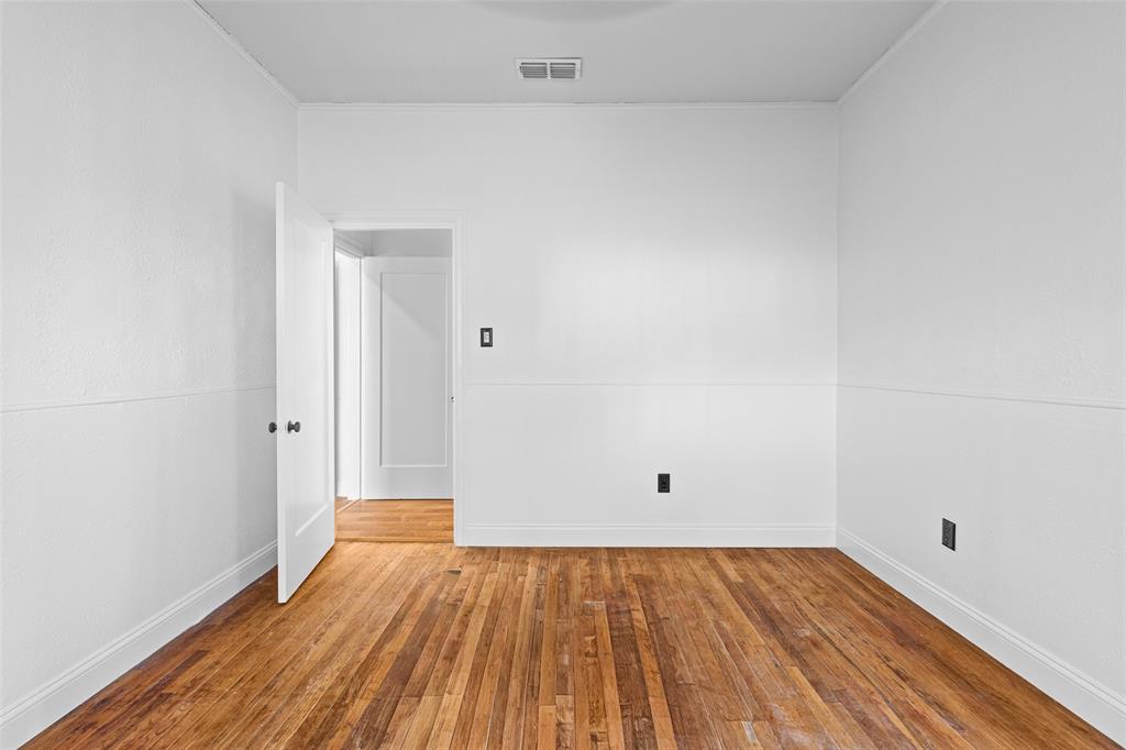204 Jones Street Longview, TX 75602 - Photo 20 of 38 a view of an empty room with wooden floor