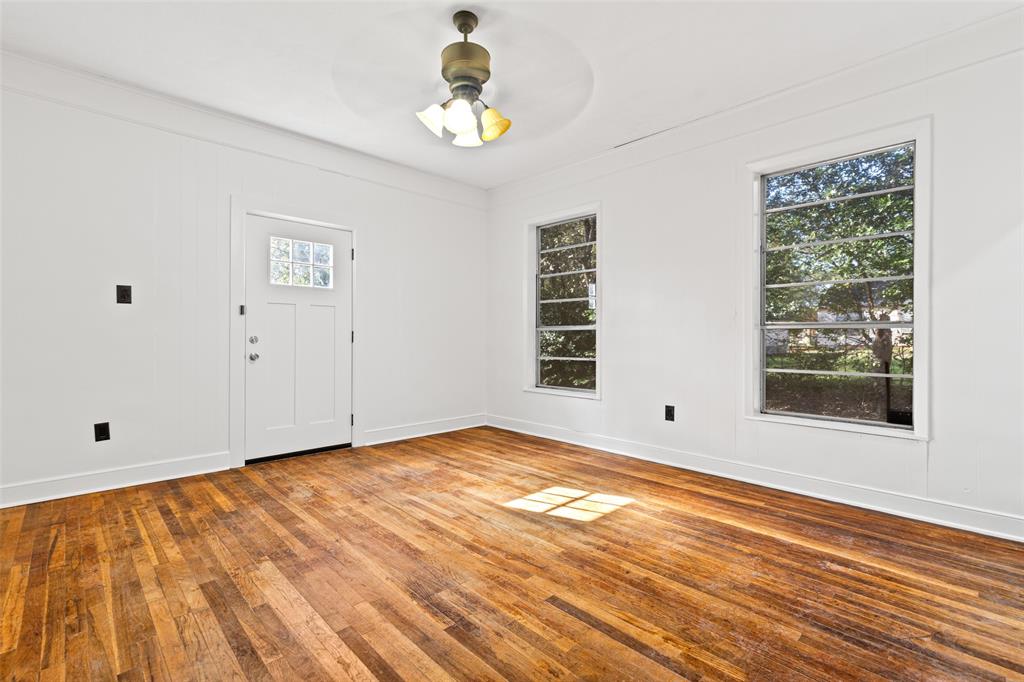 204 Jones Street Longview, TX 75602 - Photo 7 of 38 a view of empty room with wooden floor and fan