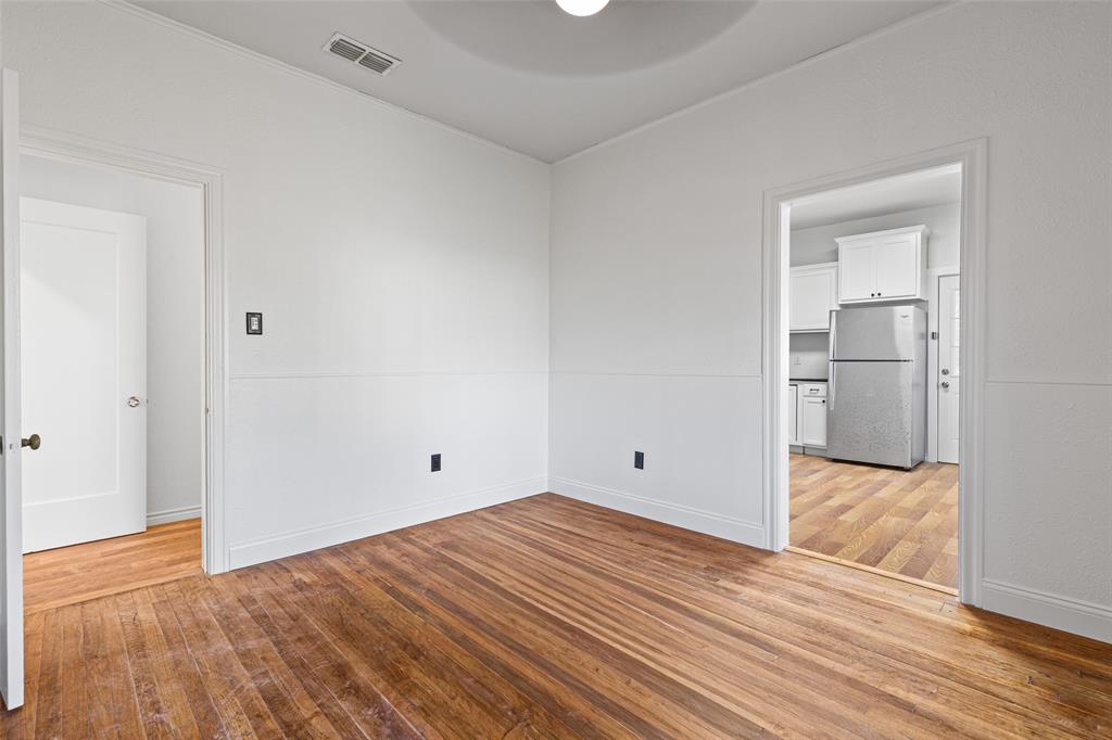 204 Jones Street Longview, TX 75602 - Photo 8 of 38 a view of empty room with wooden floor
