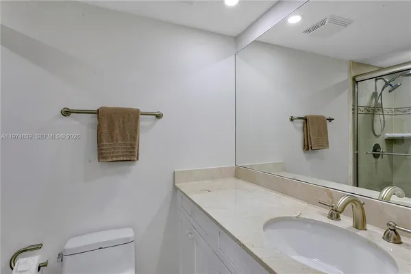 a bathroom with a sink and mirror