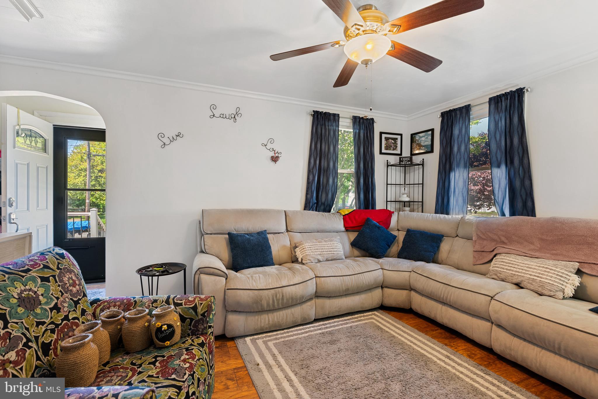 70 Del Rio Road Baltimore, MD 21222 - Photo 4 of 40 a living room with furniture ceiling fan and a rug