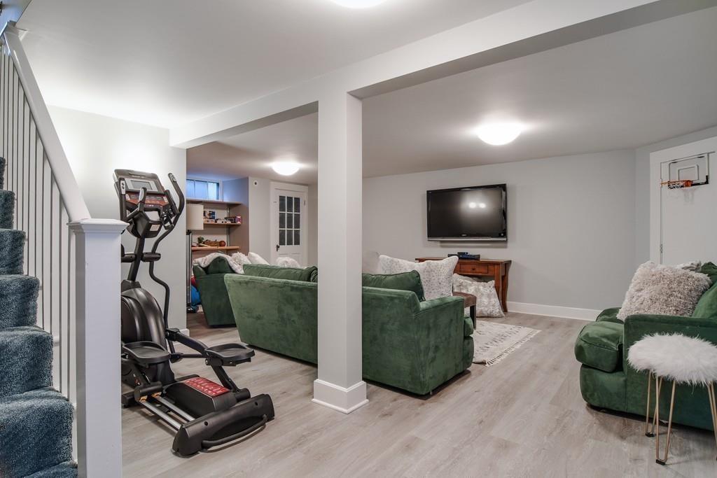 8 Fiske Road Wellesley, MA 02481 - Photo 16 of 21 a living room with furniture and a flat screen tv