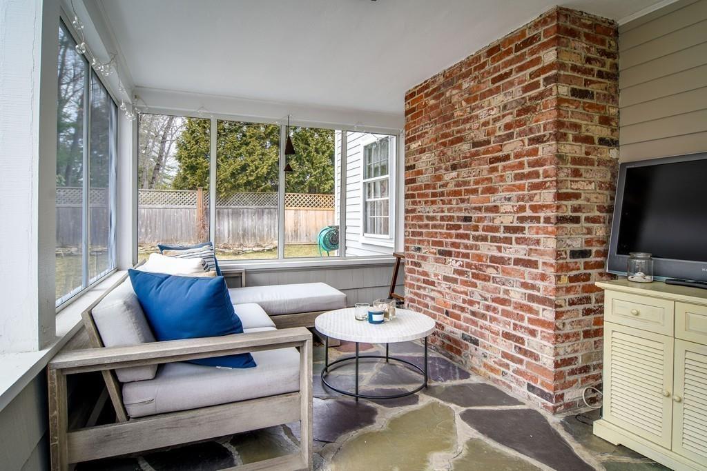 8 Fiske Road Wellesley, MA 02481 - Photo 18 of 21 a outdoor living space with furniture and a flat screen tv