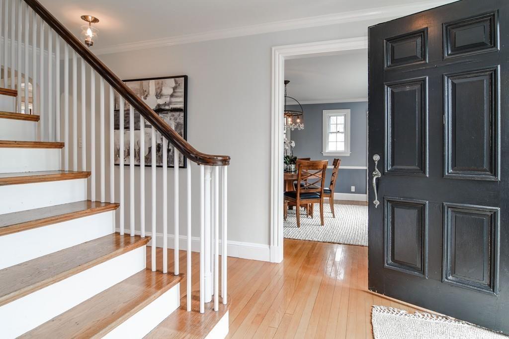 8 Fiske Road Wellesley, MA 02481 - Photo 5 of 21 a view of a hallway with wooden floor staircase and livingroom