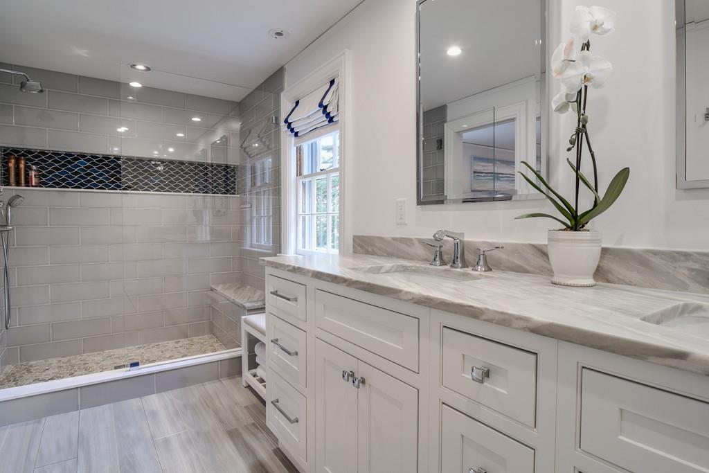8 Fiske Road Wellesley, MA 02481 - Photo 10 of 21 a bathroom with a granite countertop sink a mirror and a shower