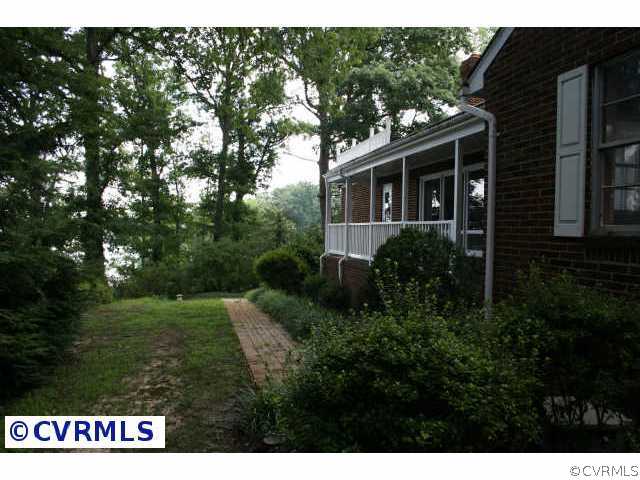 13104 Bradley Bridge Road Chester, VA 23831 - Photo 3 of 4 a view of a house with a yard
