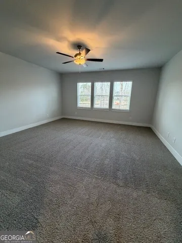 a bathroom with a tub a sink and mirror