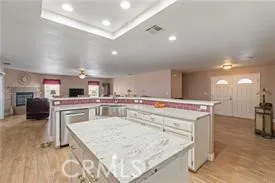 a living room with furniture fireplace and flat screen tv