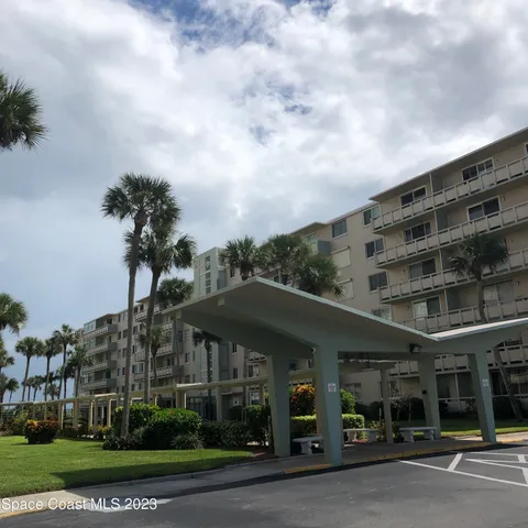 a front view of a building with garden