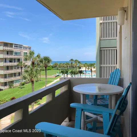 a view of a balcony with chairs