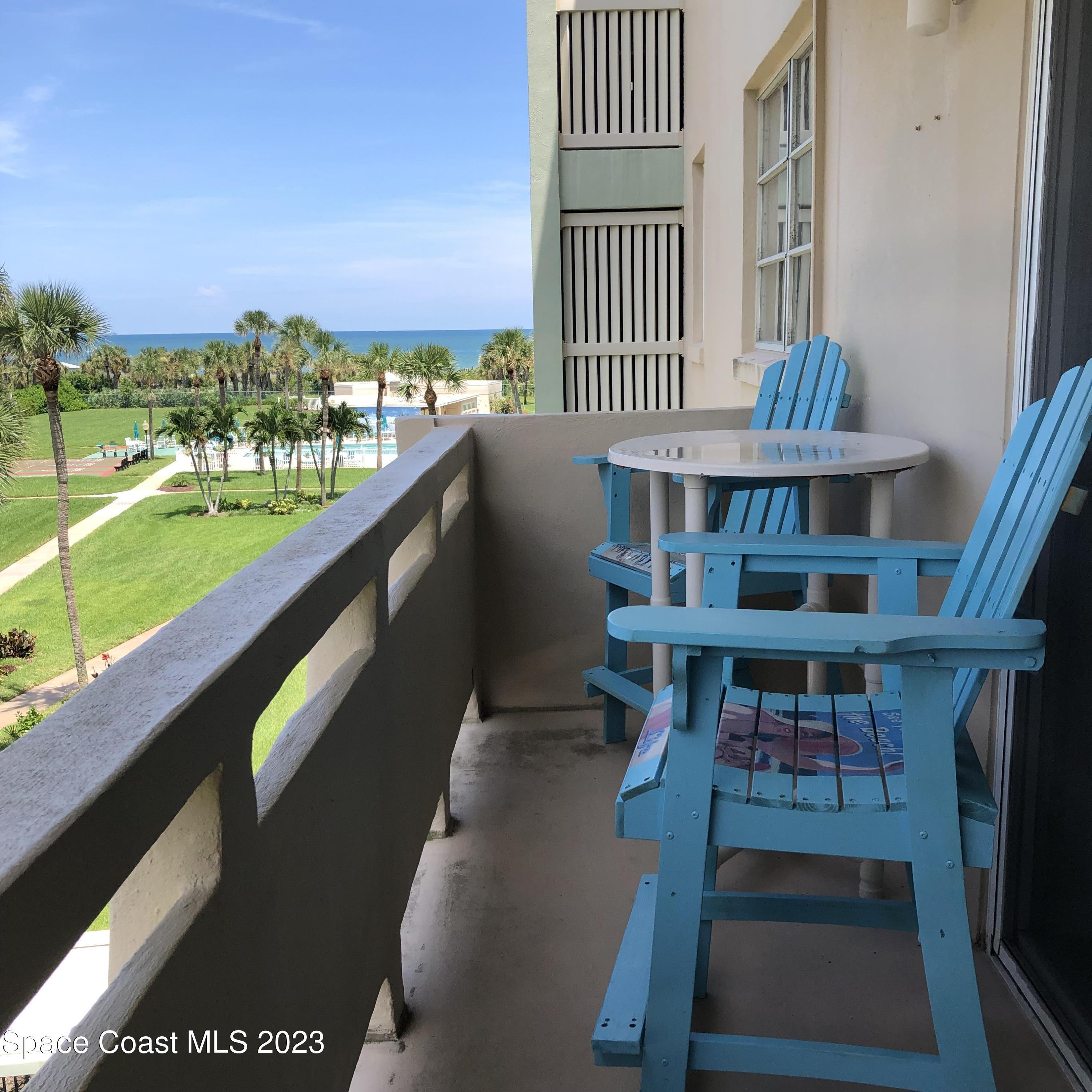 2020 North Atlantic Avenue, Unit 408S Cocoa Beach, FL 32931 - Photo 18 of 22 a view of a balcony with chairs
