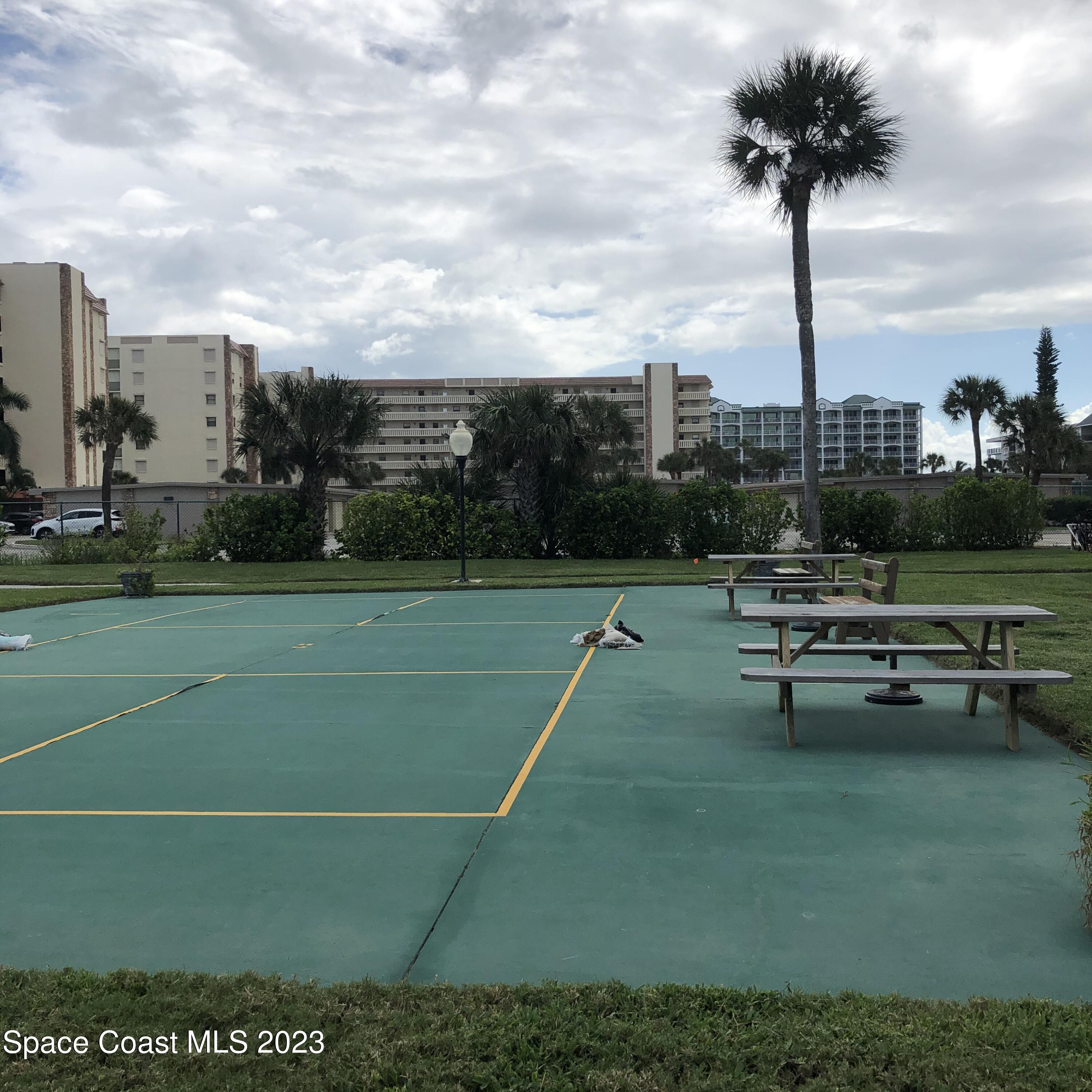 2020 North Atlantic Avenue, Unit 408S Cocoa Beach, FL 32931 - Photo 20 of 22 a view of a terrace with a bench