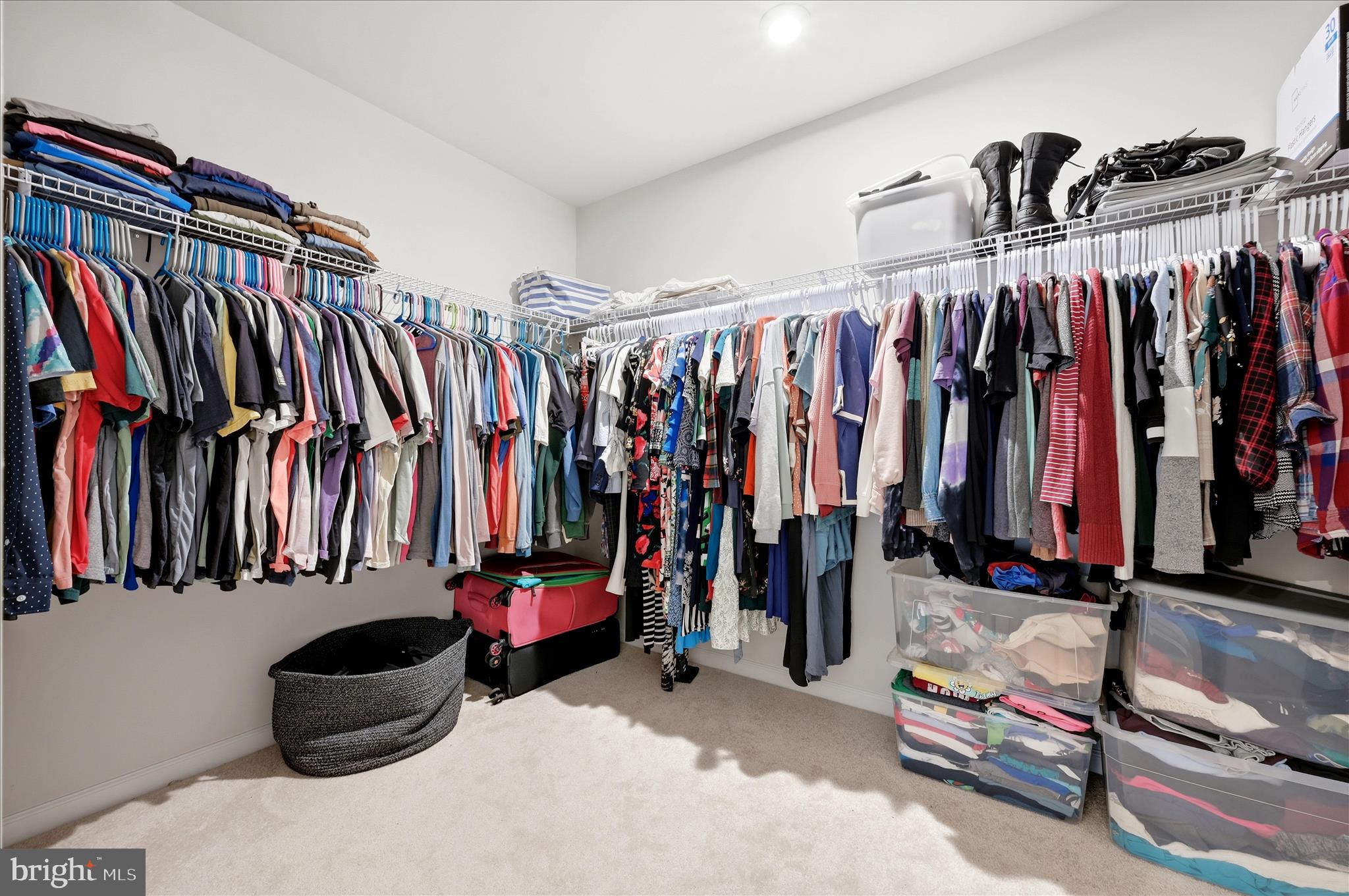 152 National Street Ranson, WV 25438 - Photo 32 of 53 a view of walk in closet with clothes and shoes