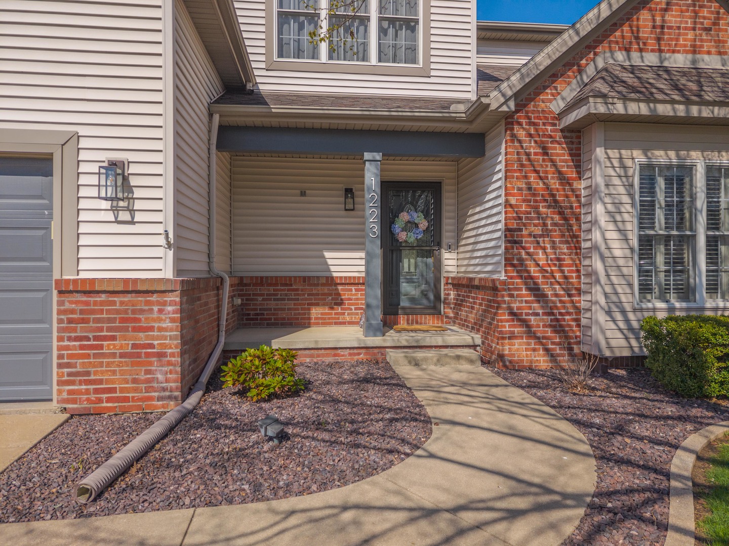 1223 Joy Walk Way Normal, IL 61761 - Photo 2 of 48 a front view of a house with garden