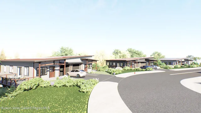 a view of a house with a swimming pool and sitting area