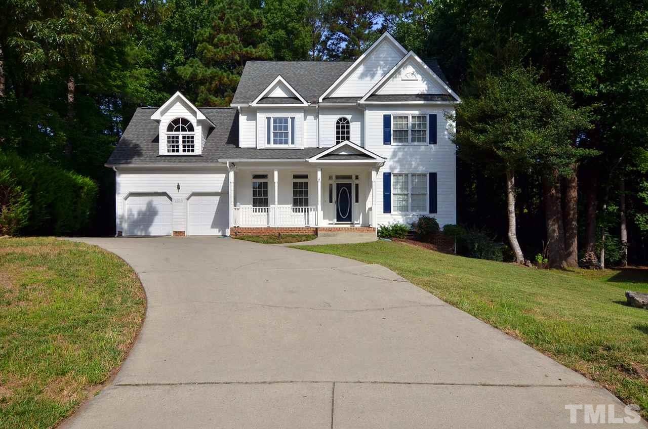 6000 Bunchberry Court Raleigh, NC 27616 - Photo 1 of 25 a front view of a house with a yard and trees