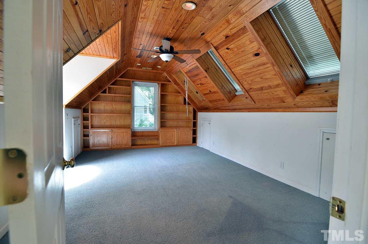 6000 Bunchberry Court Raleigh, NC 27616 - Photo 18 of 25 a view of a room with stairs and a couch