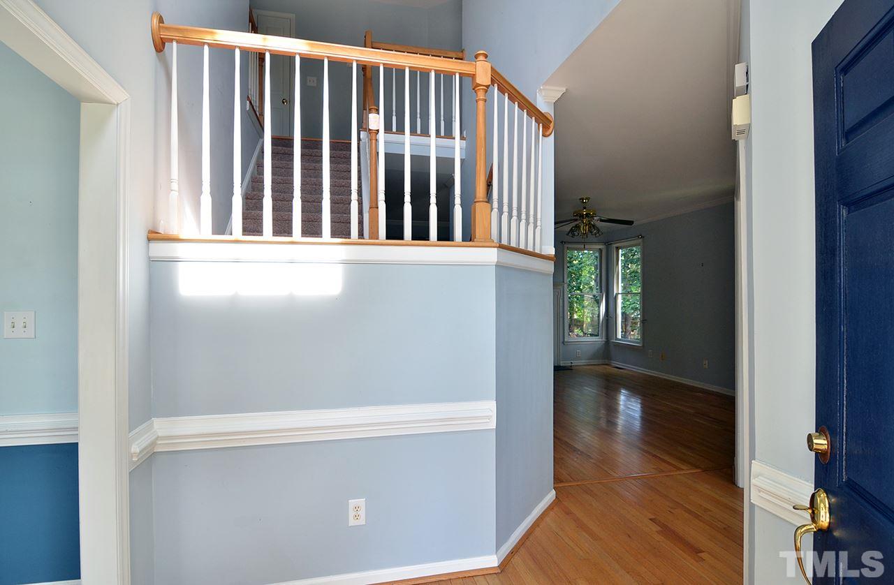 6000 Bunchberry Court Raleigh, NC 27616 - Photo 3 of 25 a view of porch with wooden floor
