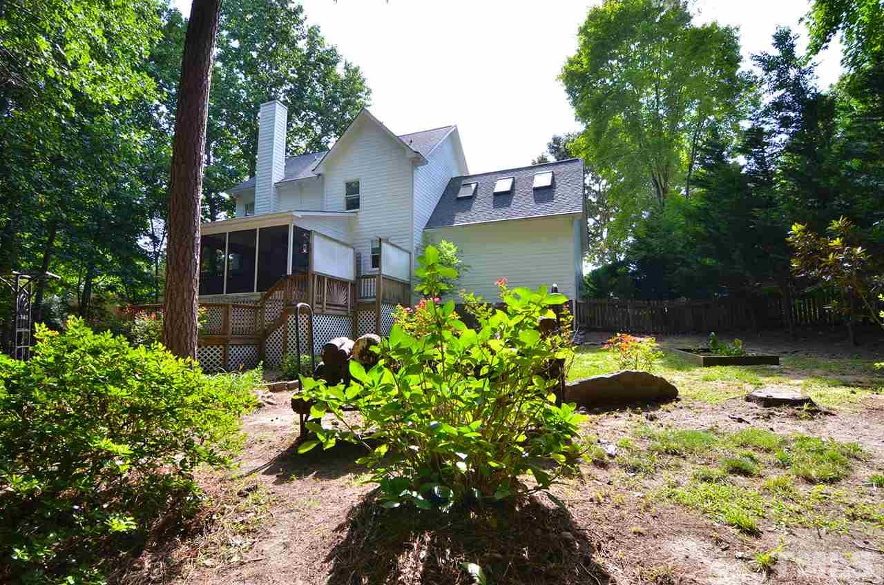 6000 Bunchberry Court Raleigh, NC 27616 - Photo 24 of 25 a backyard of a house with a yard and outdoor seating