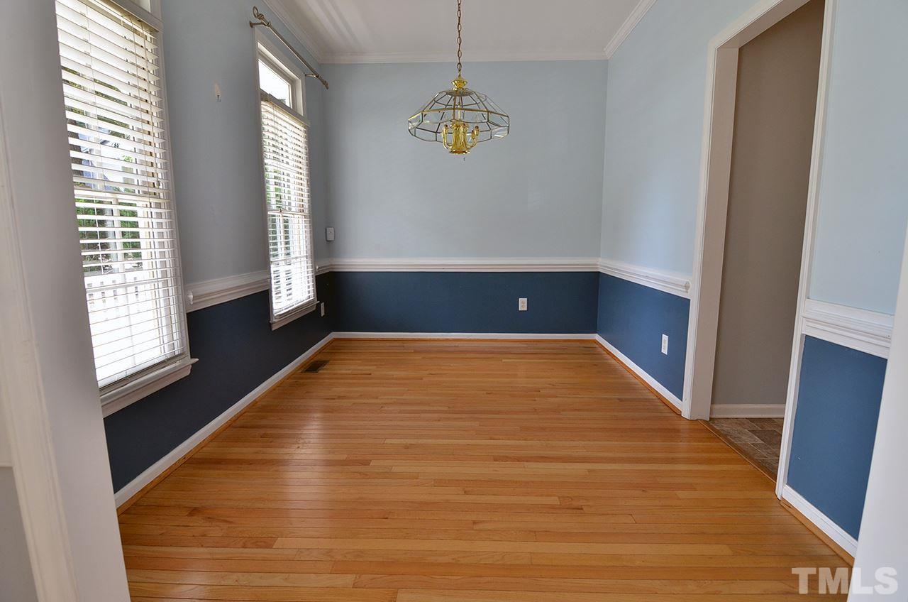 6000 Bunchberry Court Raleigh, NC 27616 - Photo 5 of 25 a view of empty room with windows and wooden floor
