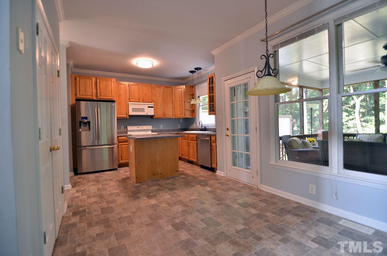 6000 Bunchberry Court Raleigh, NC 27616 - Photo 8 of 25 a kitchen with stainless steel appliances granite countertop a refrigerator and a sink
