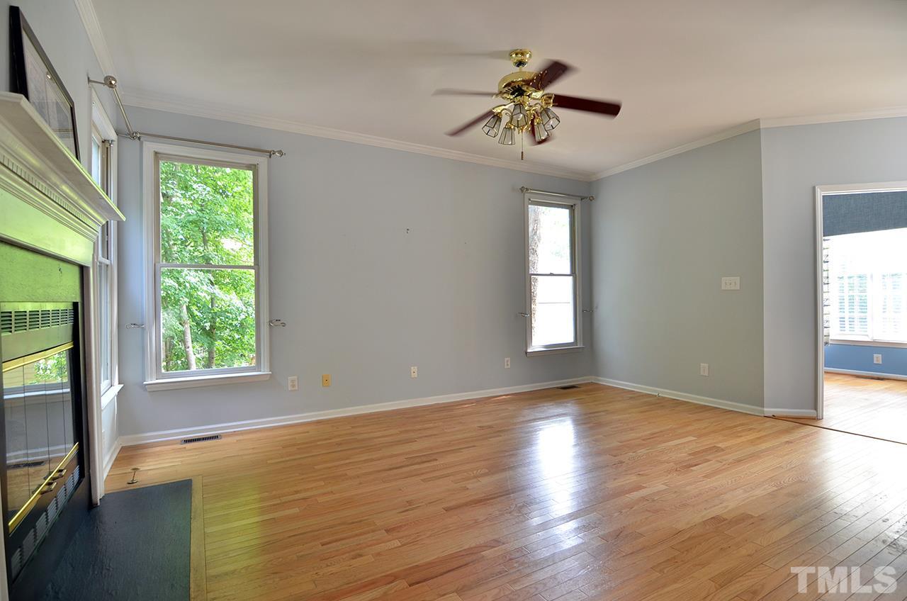 6000 Bunchberry Court Raleigh, NC 27616 - Photo 10 of 25 a view of an empty room with a window and wooden floor