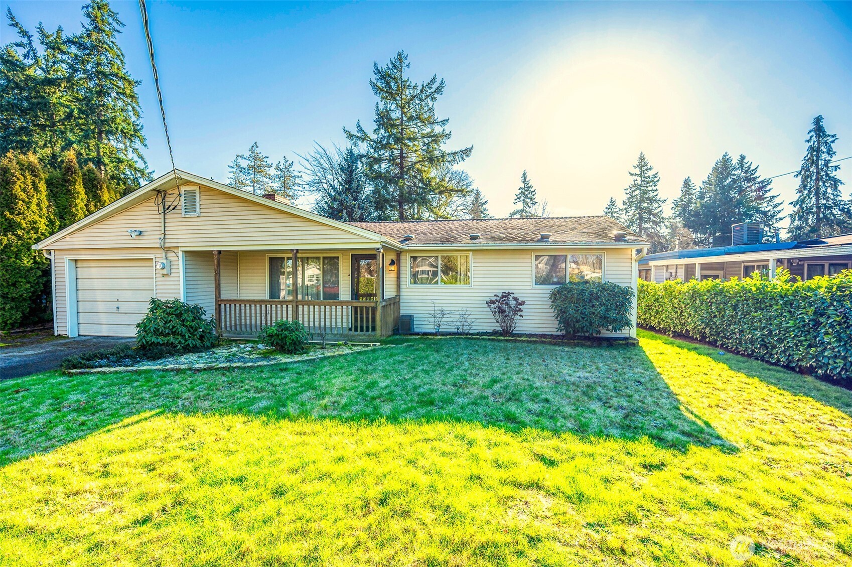 a view of a house with a yard patio and a garden