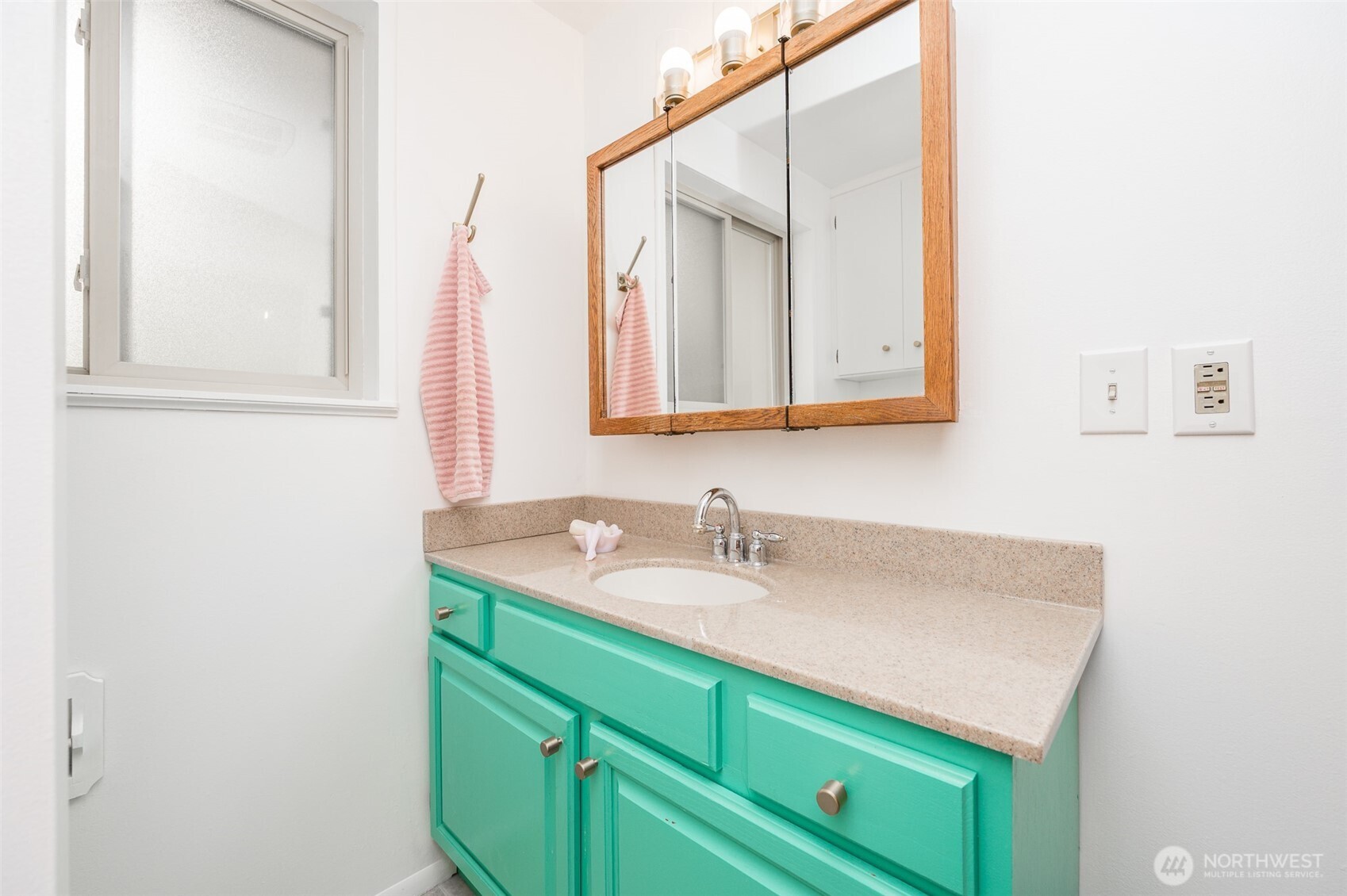 9116 121st Street Southwest Lakewood, WA 98498 - Photo 12 of 24 a bathroom with a sink and a mirror