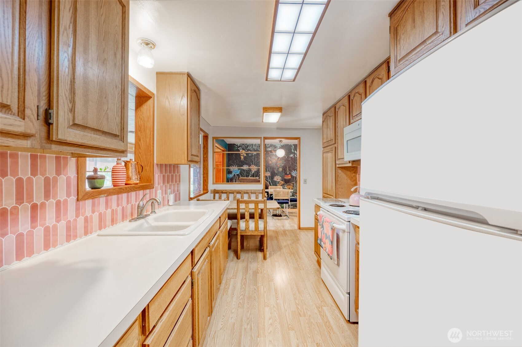 9116 121st Street Southwest Lakewood, WA 98498 - Photo 6 of 24 a dining room with furniture and a wooden floor