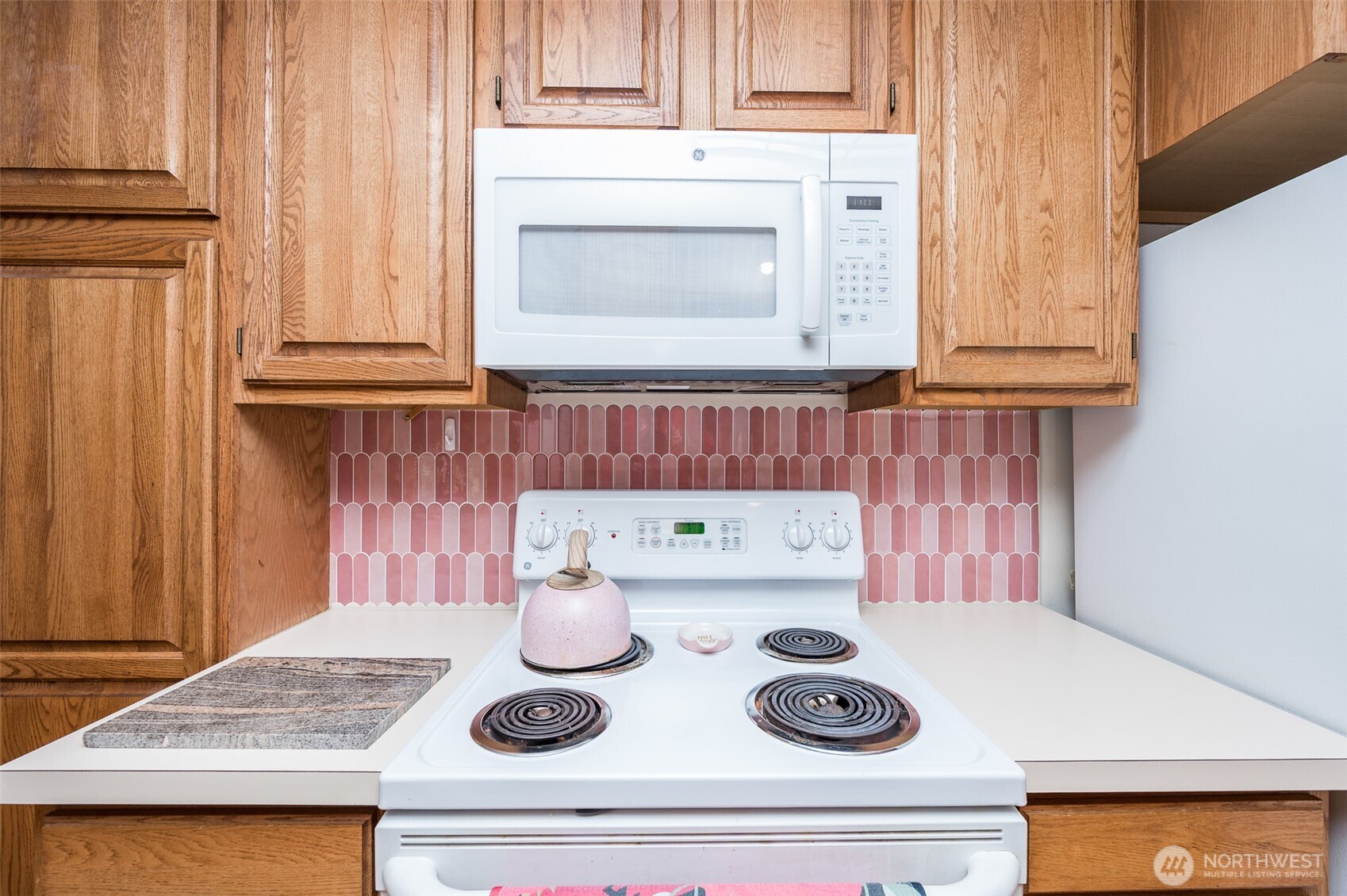 9116 121st Street Southwest Lakewood, WA 98498 - Photo 7 of 24 a kitchen with a stove and cabinets